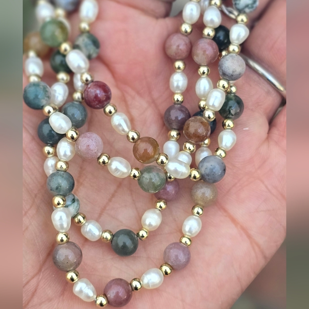 Gorgeous rainbow multi gemstone, gold plated balls, and pearl infinity necklace